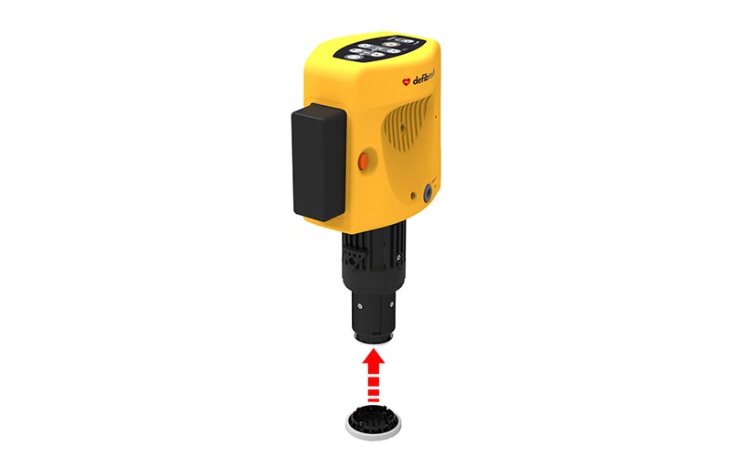 Yellow industrial pump unit above floor drain