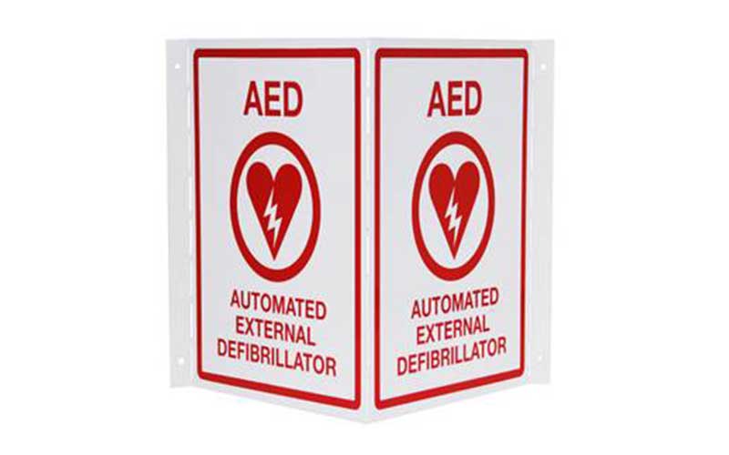 Corner-mounted AED automated external defibrillator sign