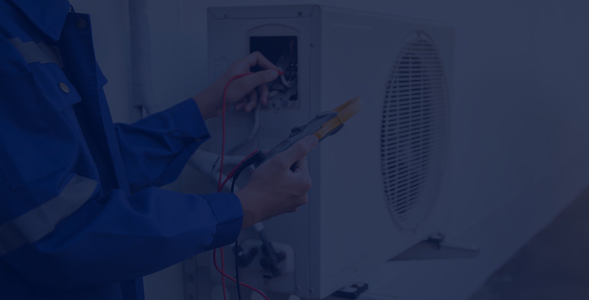 Technician checking an outdoor air conditioning unit with a multimeter.