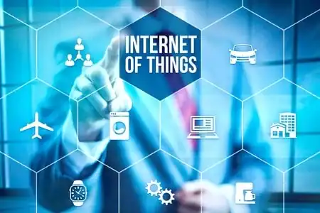 Internet of Things concept with connected devices and technology icons.