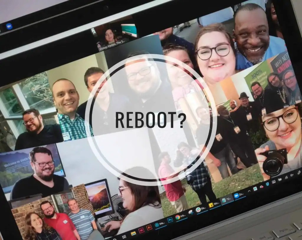 Group of diverse people smiling during a virtual meeting on a laptop screen.