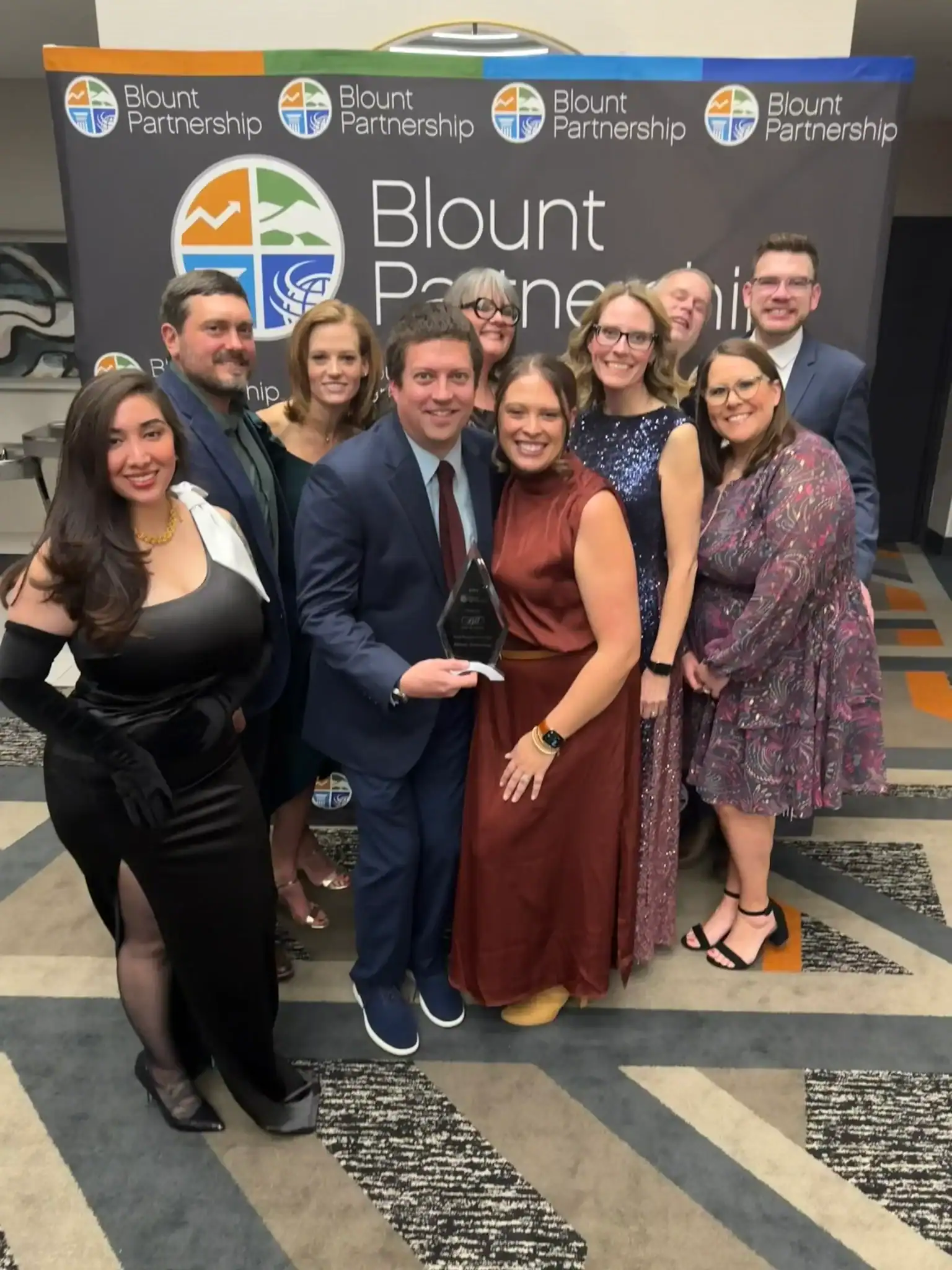 Group of professionals at Blount Partnership event with Allevia Technology branding.