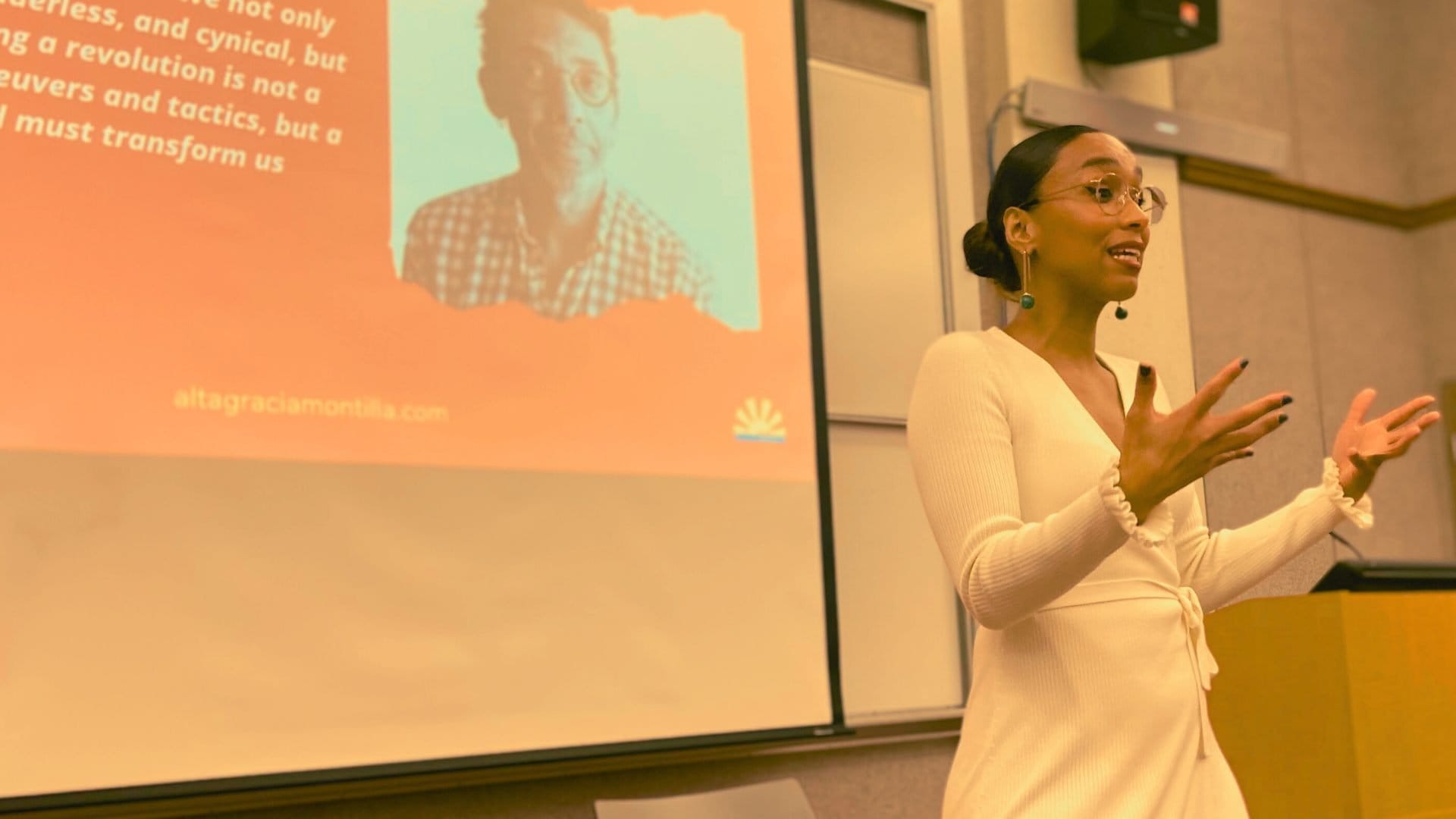 Altagracia Montilla presenting in a warm-lit room
