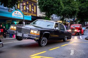 Black vintage Cadillac car at Americarna event in New Zealand, classic American automobiles on display.