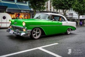 Vibrant green and white vintage Chevrolet car at Americarna event in New Zealand, showcasing classic American muscle cars.