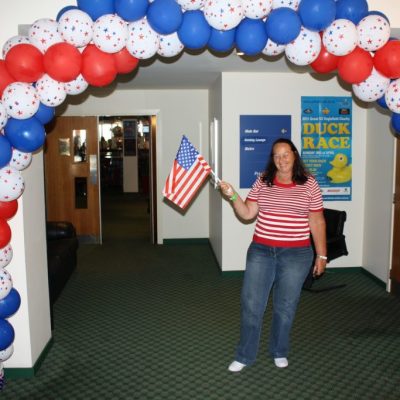 Festive American-themed balloon arch for patriotic celebration at AmericaRNAs event.