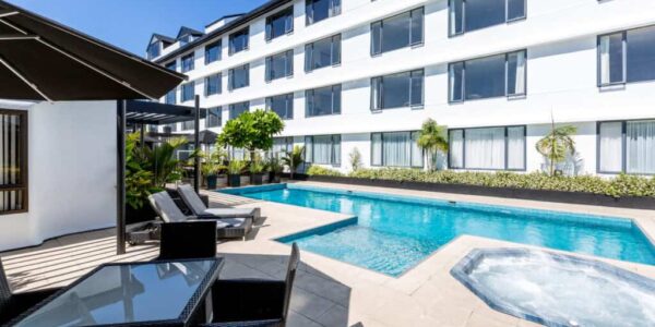 Contemporary hotel with outdoor pool and hot tub at Americarna event.