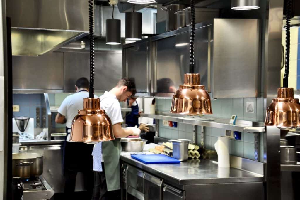 a group of people in a kitchen