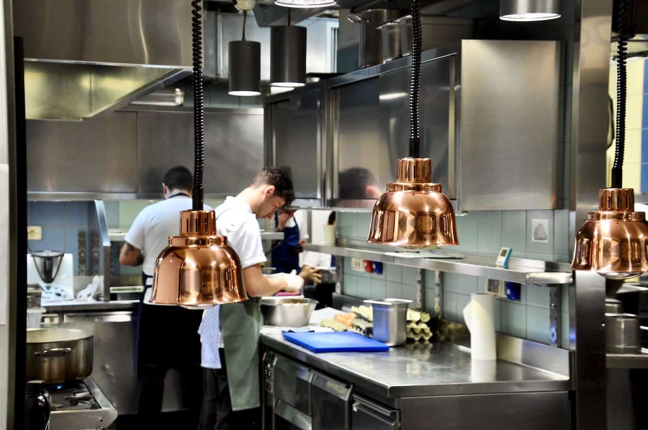 a group of people in a kitchen