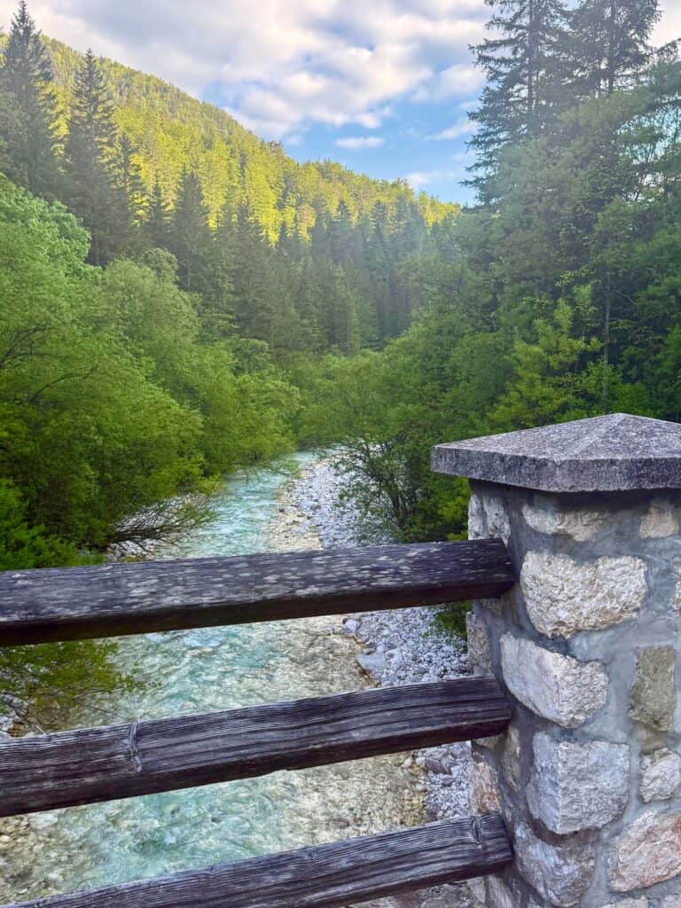 a stone fence overlooking a river
