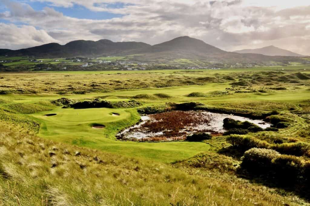 Lush golf course with scenic mountains