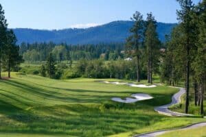 Lush golf course with scenic mountains