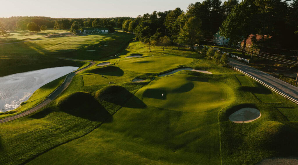 Lush golf course with scenic landscape.