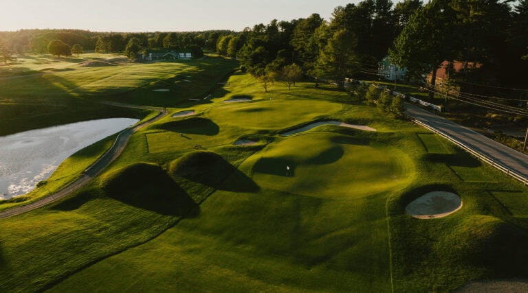 Lush golf course with scenic landscape.