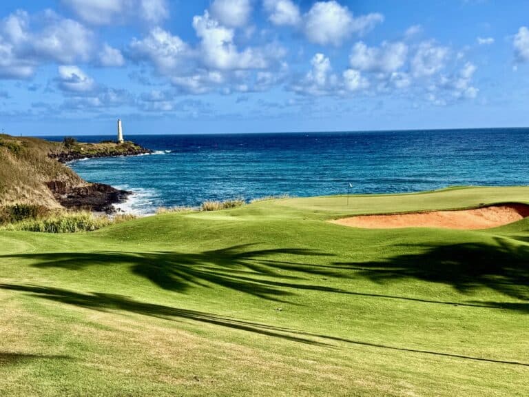 Golf course with ocean and mountains