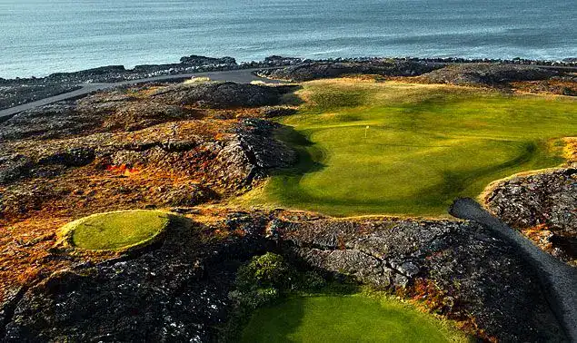Coastal golf course with rocky landscape