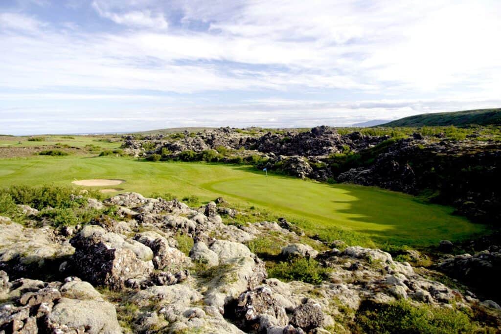 Lush golf course amidst rocky landscape