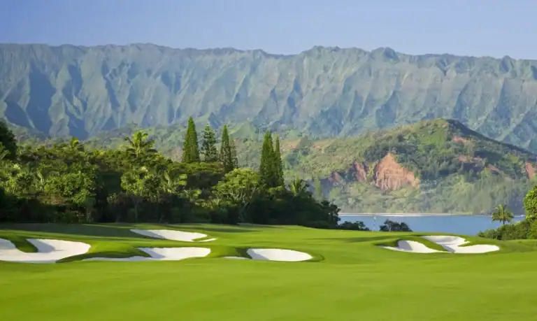 Lush golf course with mountain backdrop
