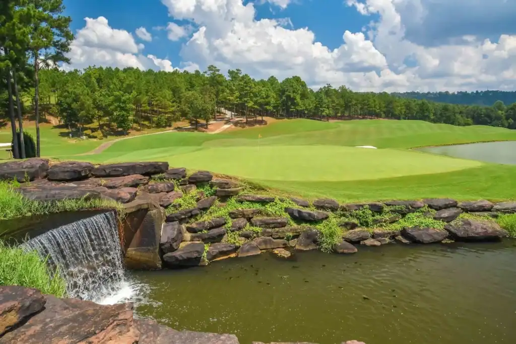 Lush golf course with serene water feature