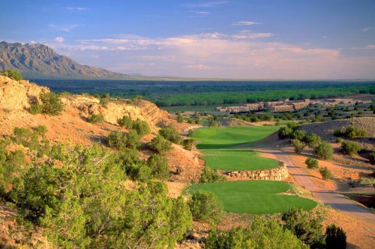 Lush golf course with mountain backdrop