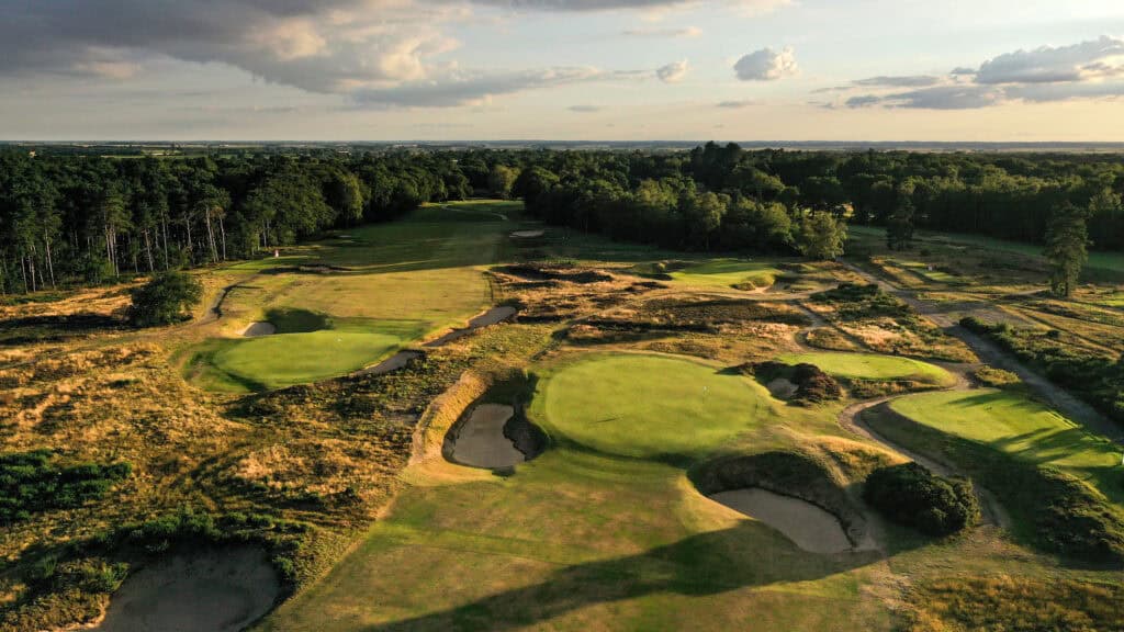 Lush golf course under a sunset