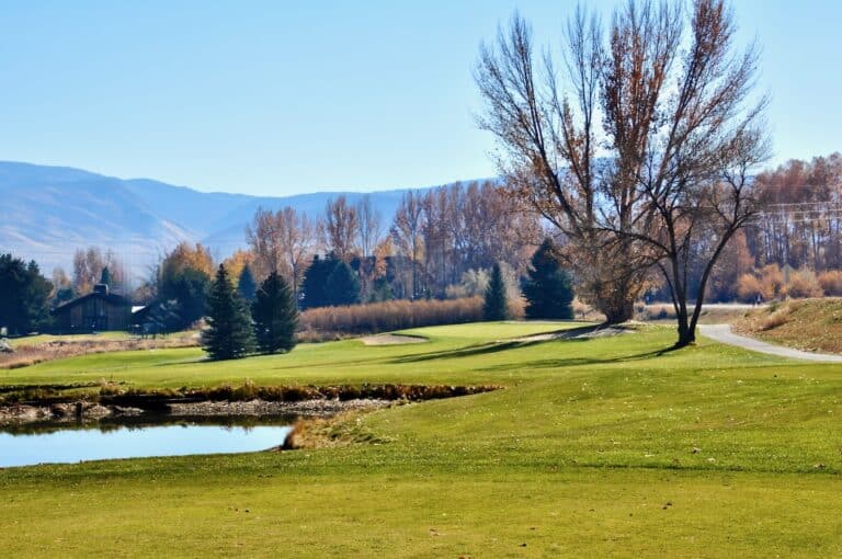 Scenic golf course with autumn trees