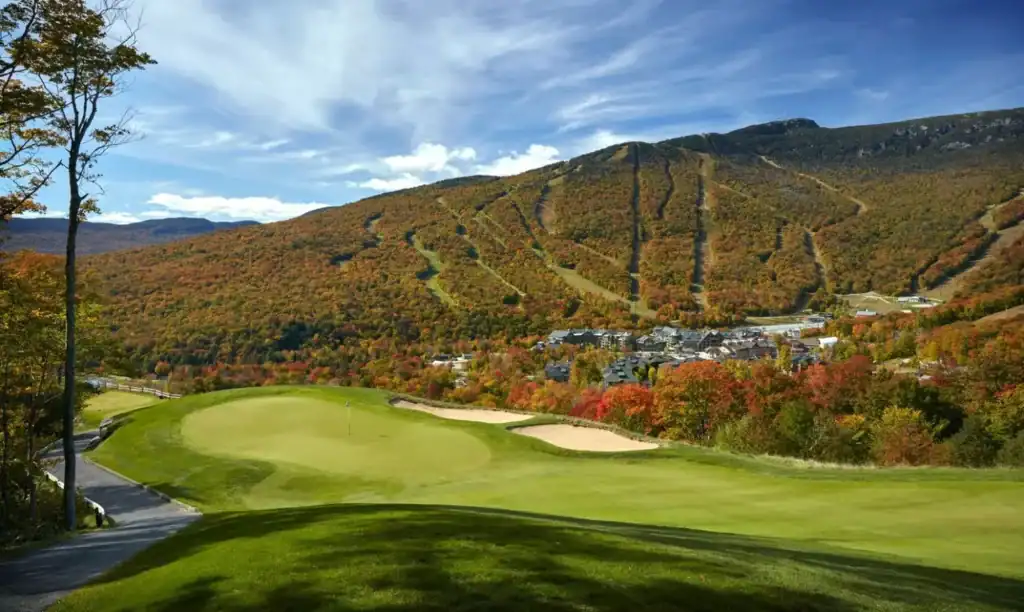 Scenic golf course in autumn landscape.