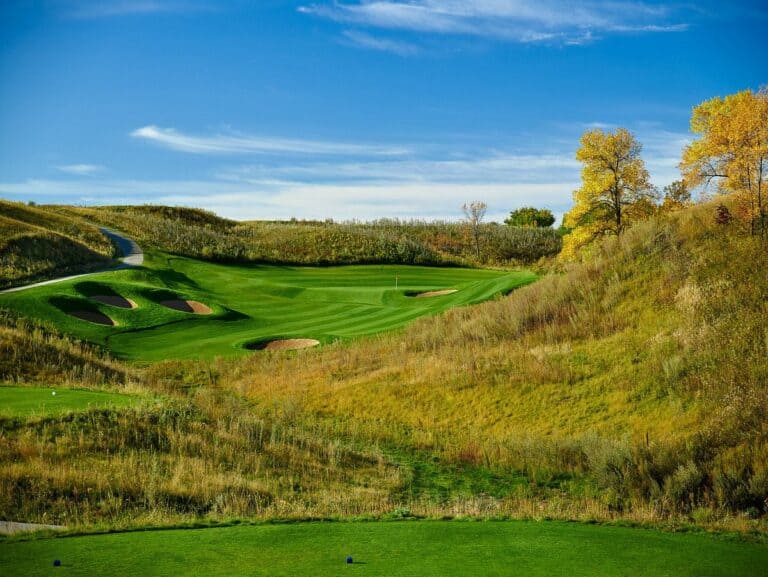 Lush golf course under blue sky