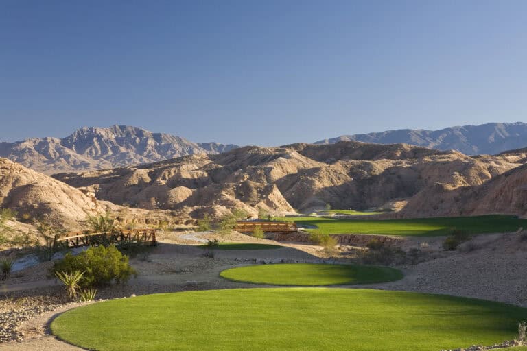Lush green golf course in desert