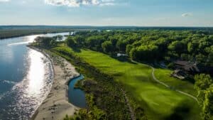 Lush golf course beside a river.