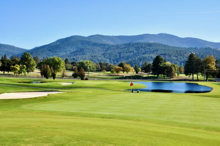 Meadowwood Lush golf course with scenic mountains