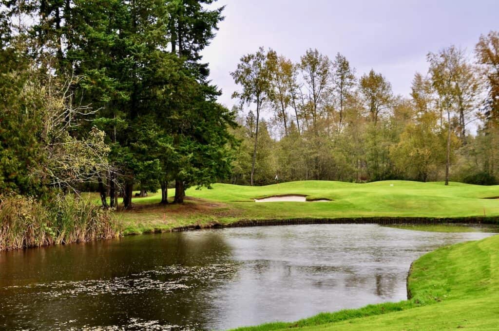 Serene golf course with water feature