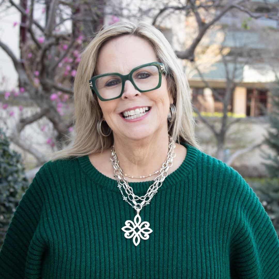Portrait of Christie Roberts, owner of Moxie on Second and A Few Doors Down