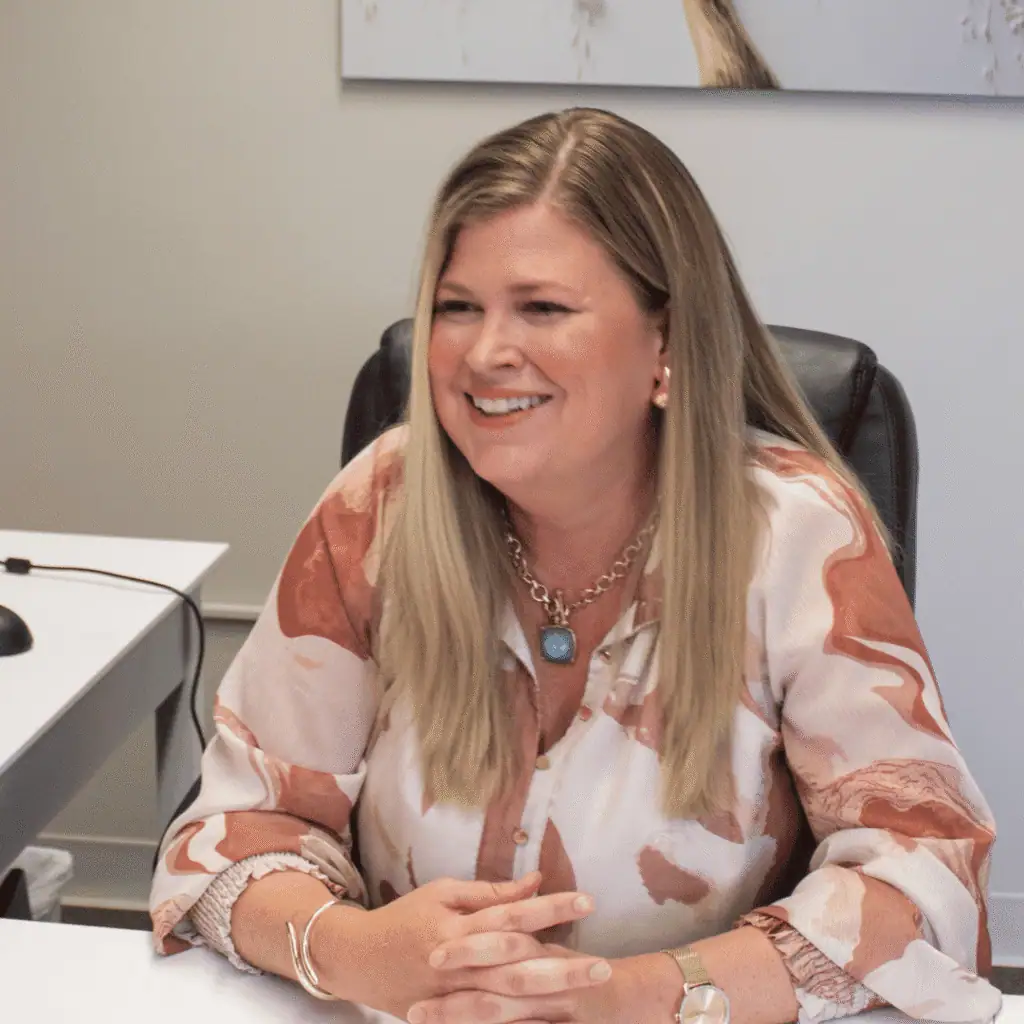 Dr. Andrea Wagner visits with a patient during a hearing consultation at Advanced Hearing Care in Bartlesville, Oklahoma.