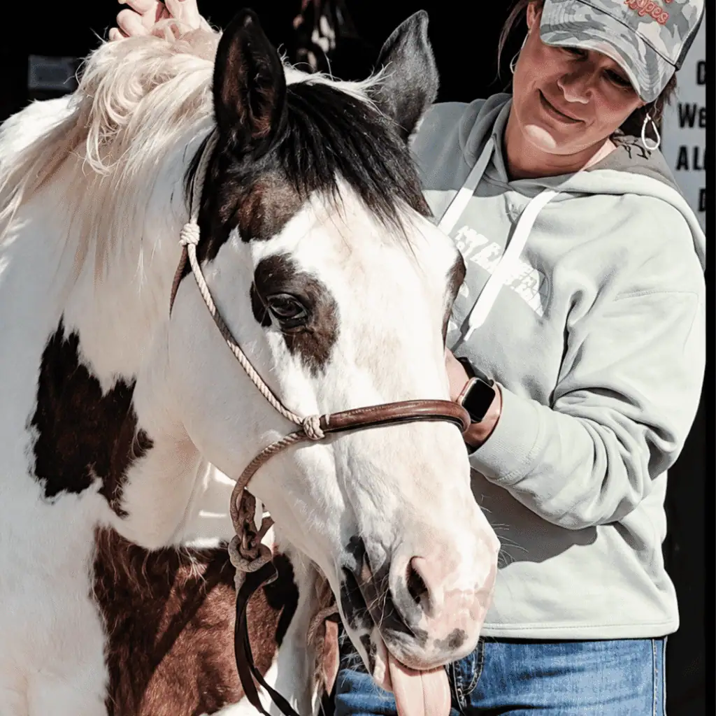 Tricia Phillips with Joe, the paint horse she has owned since she was ten years old.