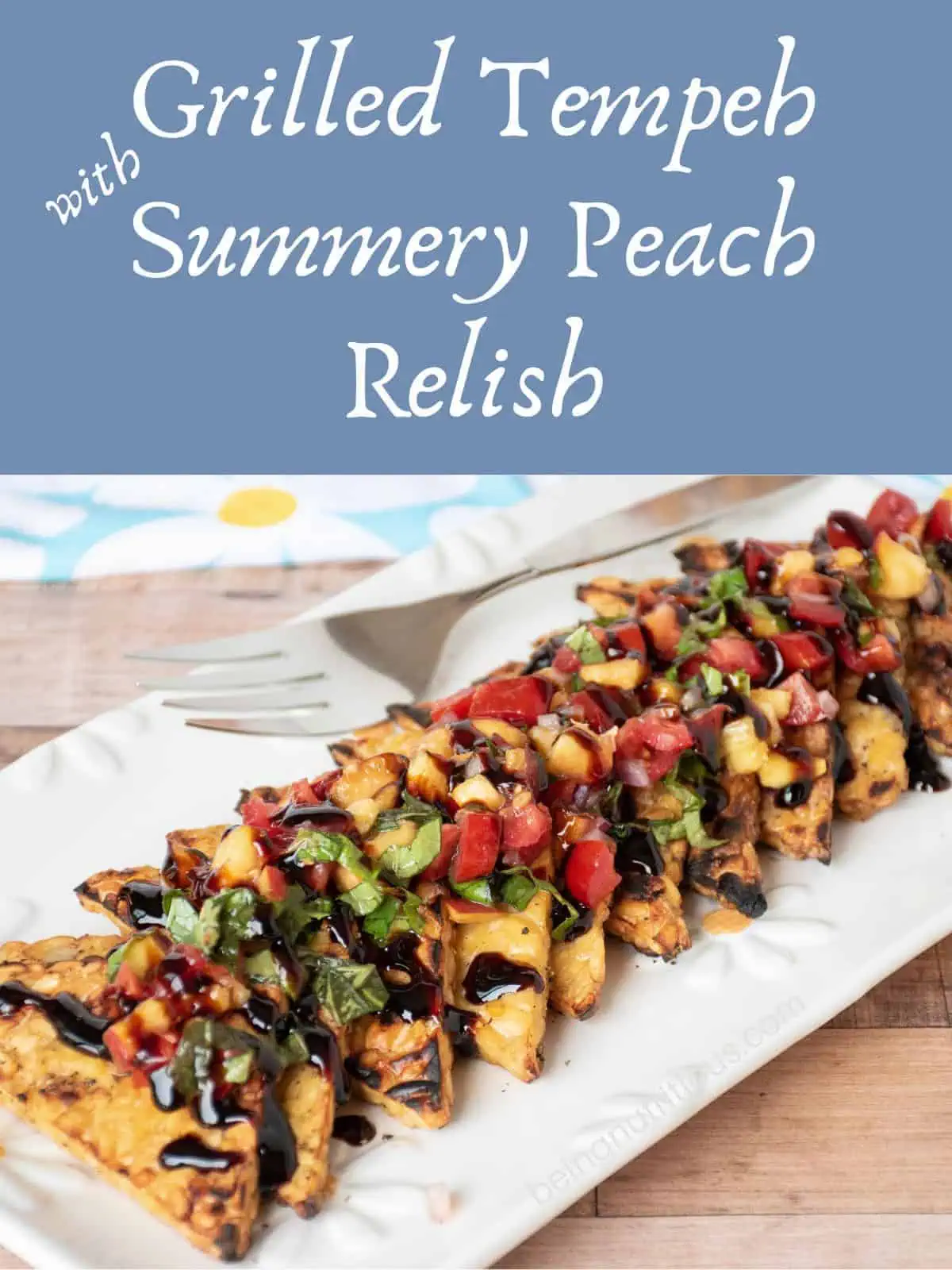 Grilled tempeh triangles in a line on a plate, topped with peach relish and drizzled with balsamic glaze. Text overlay: Grilled Tempeh with Summery Peach Relish.