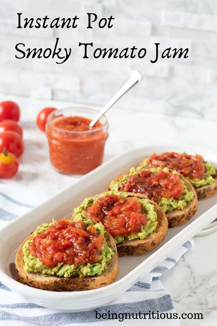 Tomato Jam on small round slices of rye bread topped with mashed avocado. Text overlay: Instant Pot Smoky Tomato Jam