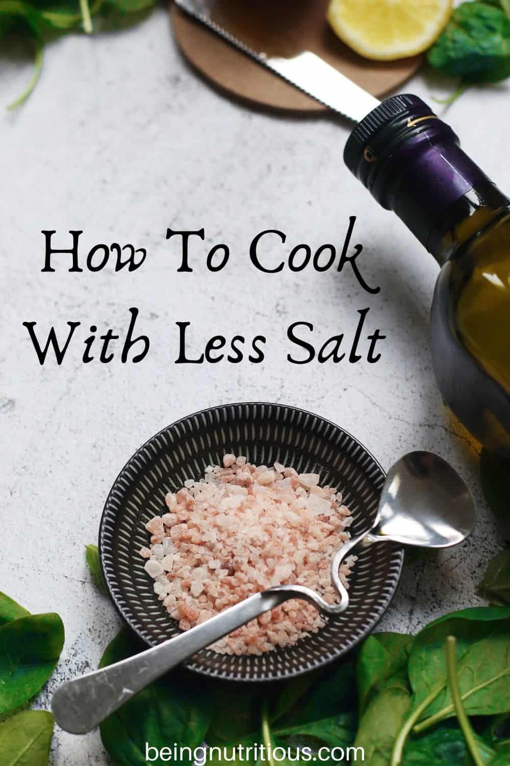Small dish of pink salt, with decorative items surrounding. Text overlay: How to cook with less salt.