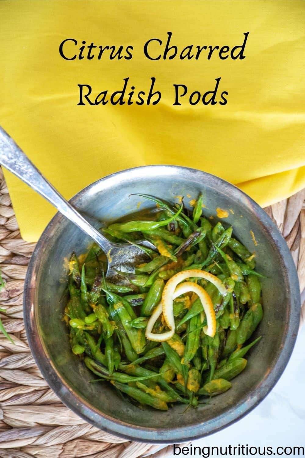 Overhead shot of a silver bowl of charred radish pods with a silver fork in it, and text overlay: "Citrus Charred Radish Pods"