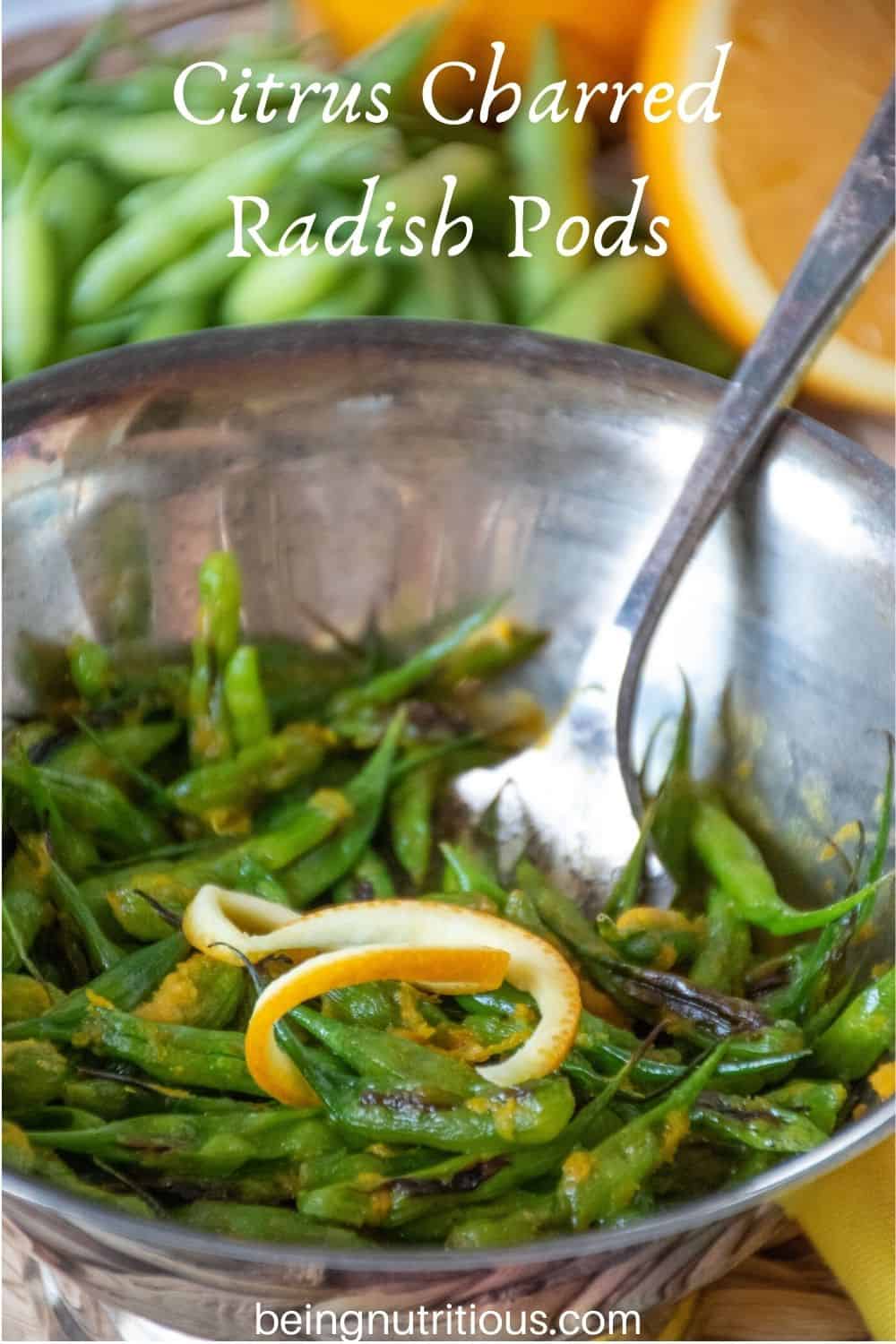 Silver bowl with charred radish pods, garnished with orange peel. Fresh radish pods in background with text overlay: "Citrus Charred Radish Pods"