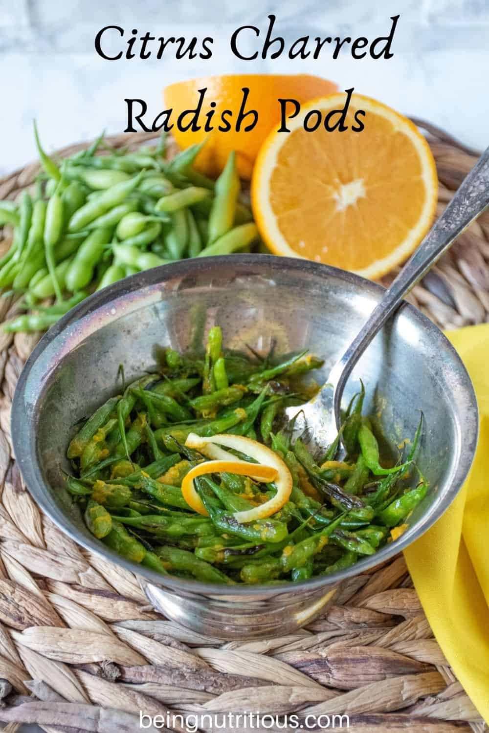Silver bowl with charred radish pods, garnished with orange peel. Fresh radish pods in background with text overlay: "Citrus Charred Radish Pods"