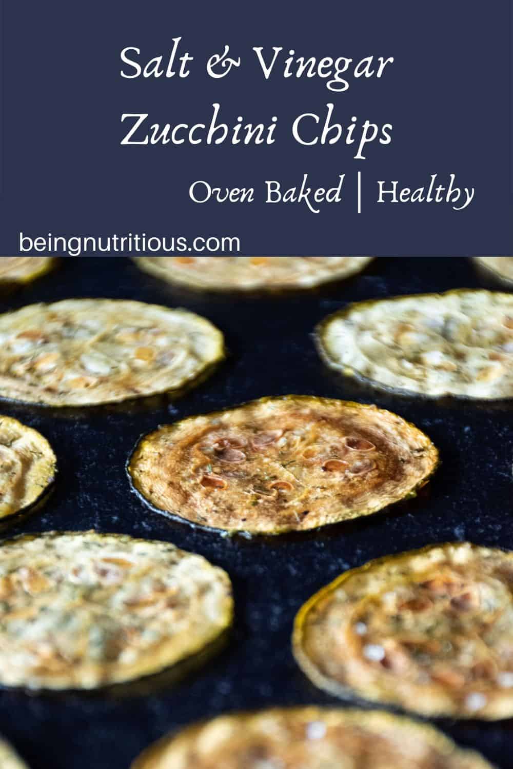Zucchini chips arranged on a dark background, in a single layer, equidistant apart.