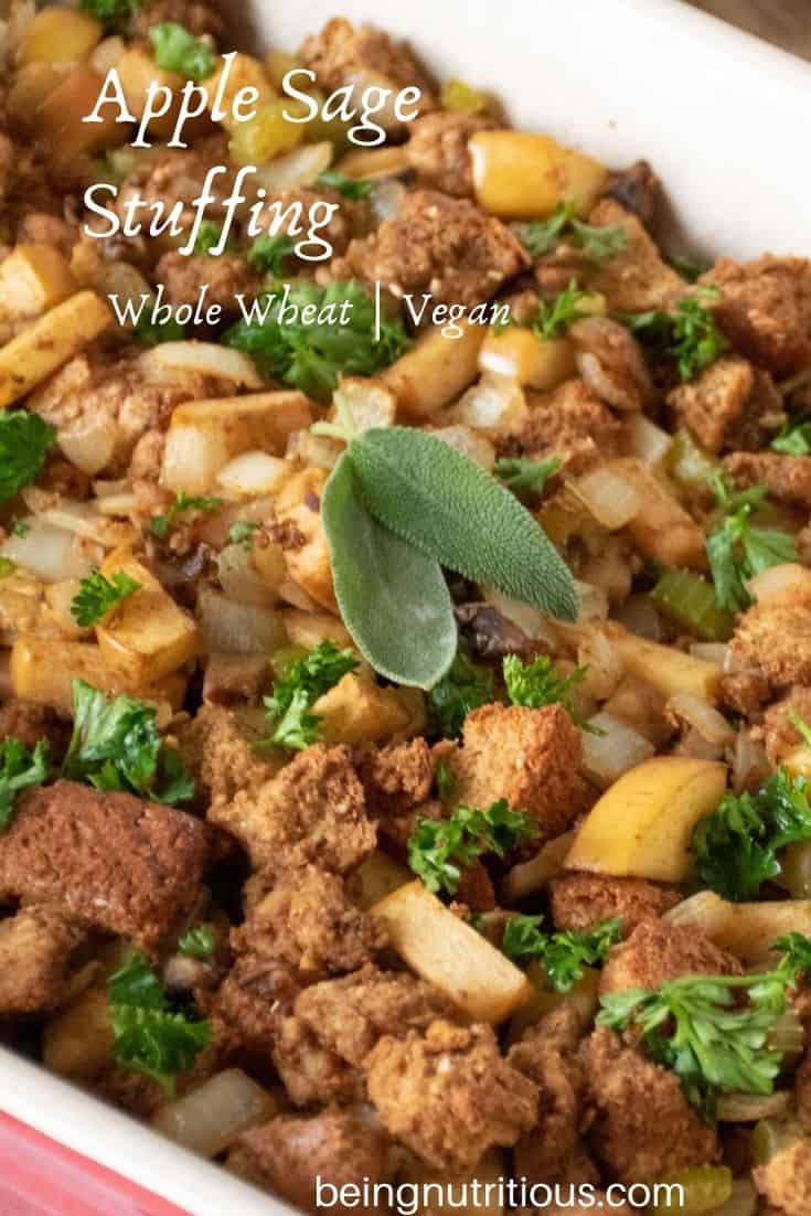 Close up of stuffing, garnished with 2 fresh sage leaves. Text overlay: apple sage stuffing, whole wheat, vegan.