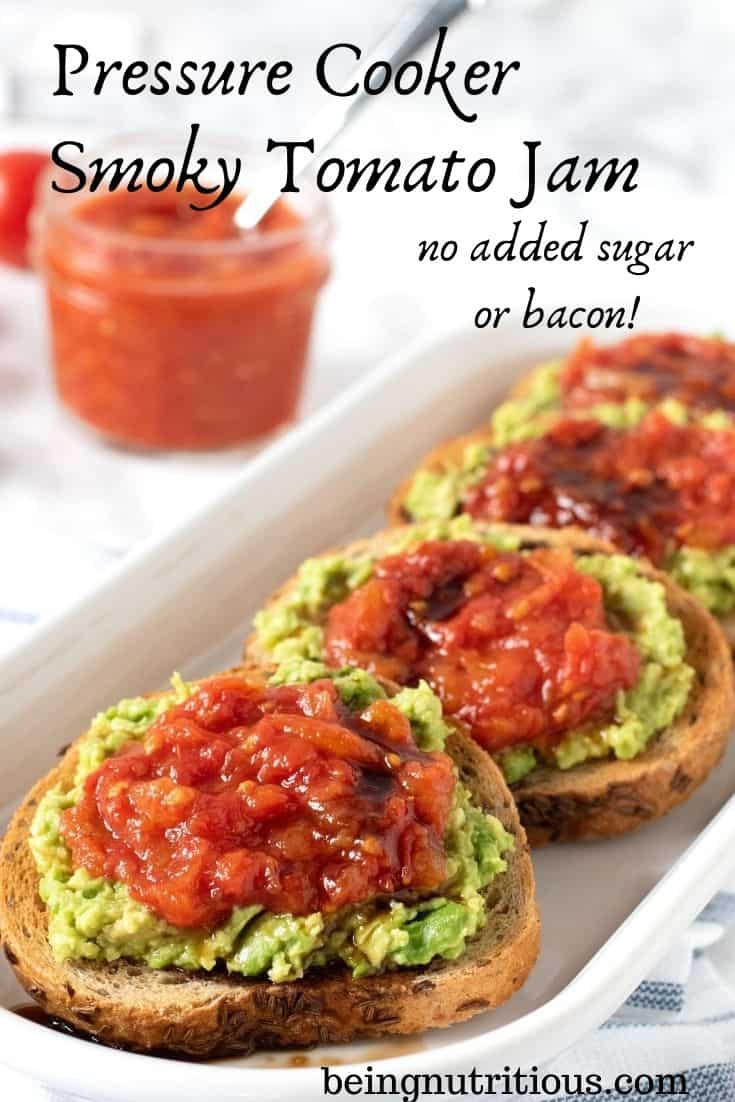 An oval, white dish with 4 round slices of rye bread smeared with avocado, and topped with tomato jam, drizzled with balsamic vinegar. Text overlay: Pressure Cooker Smoky Tomato Jam, no added sugar or bacon.