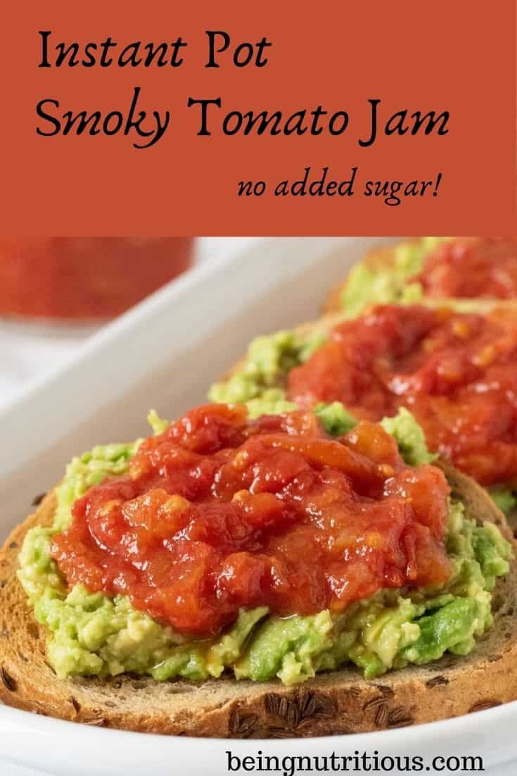 Close up of a round slice of rye bread smeared with avocado, and topped with tomato jam. Text overlay inside a red box: Instant Pot Smoky Tomato Jam, no added sugar.