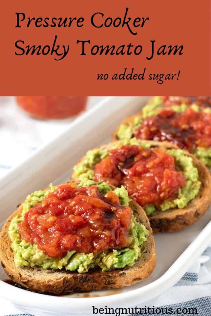 An oval, white dish, with 4 small, round slices of rye bread smeared with avocado, and topped with tomato jam, and drizzled with balsamic vinegar. Text overlay inside a red box: Pressure Cooker Smoky Tomato Jam, no added sugar.