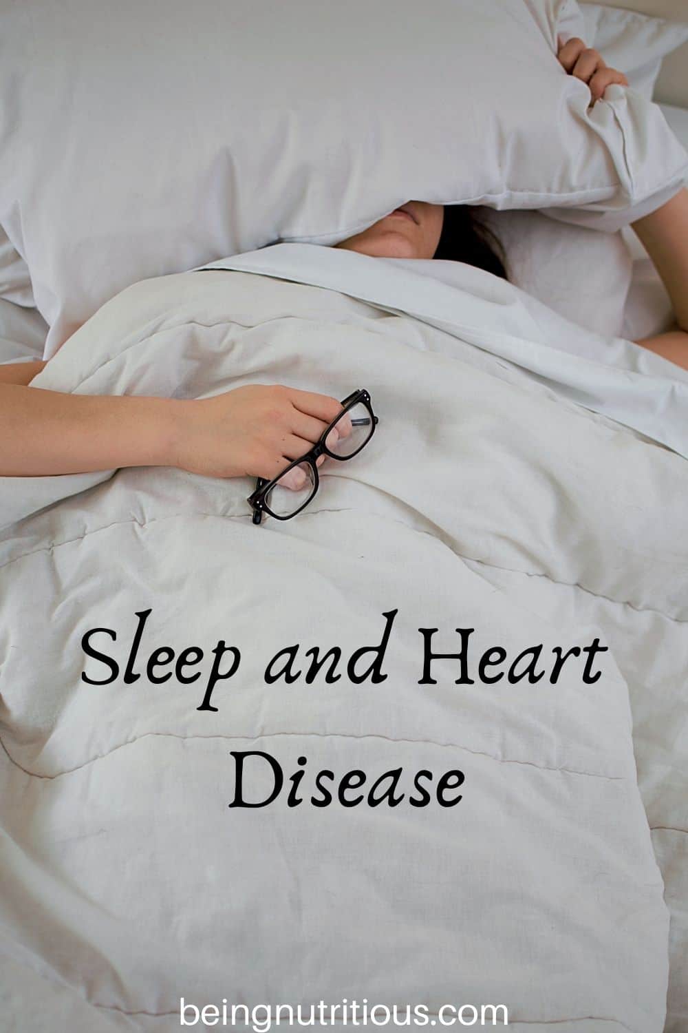 Woman sleeping under her covers with text overlay: Sleep and Heart Health.