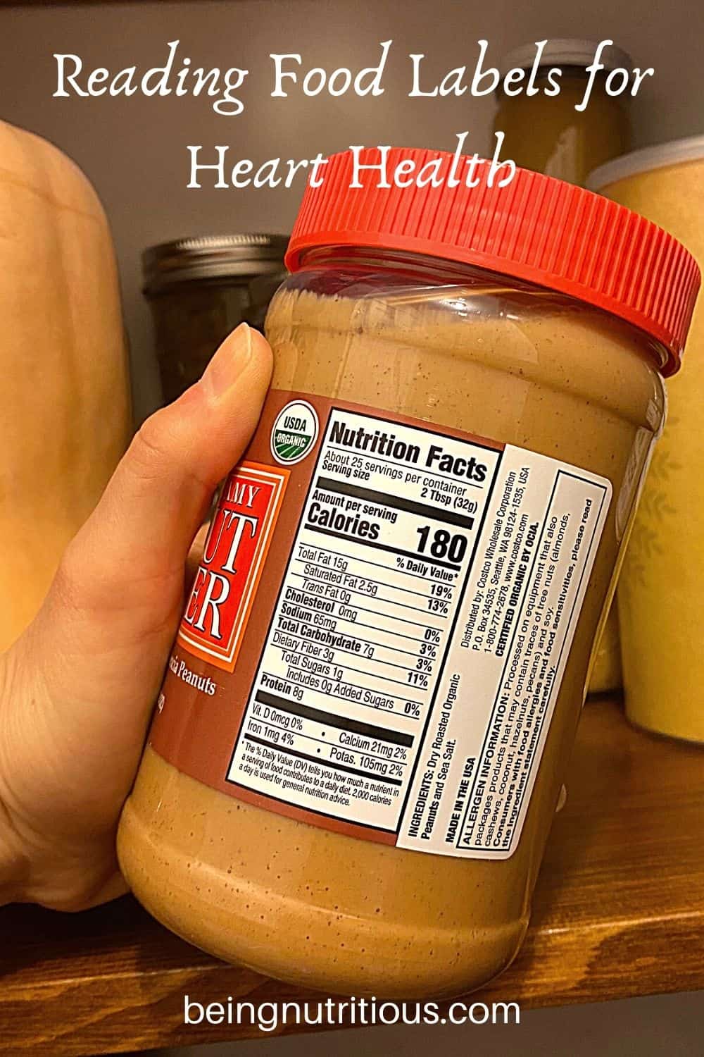 Hand holding a jar of peanut butter, with the nutrition facts label showing. Text overlay: Reading Food Labels for Heart Health