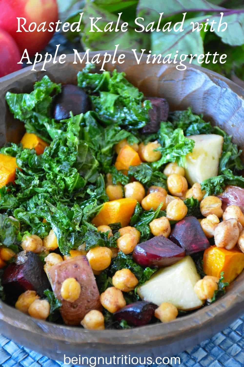 Kale salad in a wooden bowl. Text overlay: Roasted Kale Salad with Apple Maple Vinaigrette.