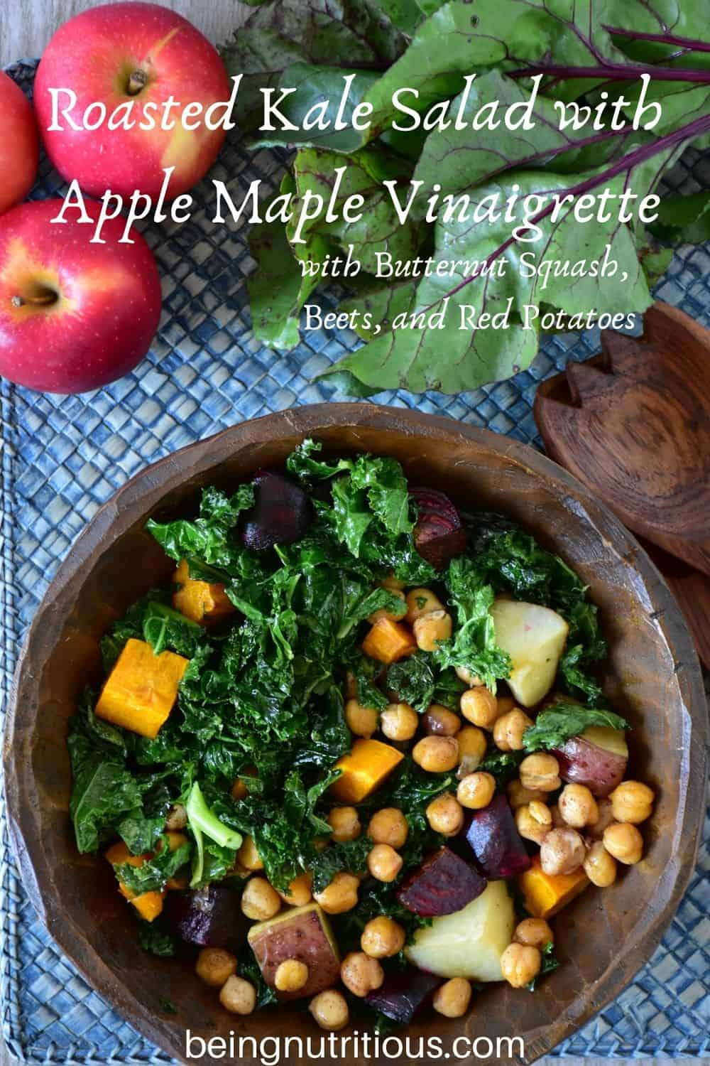 Overhead shot of kale salad in a wooden bowl. Text overlay: Roasted Kale Salad with Apple Maple Vinaigrette, with butternut squash, beets, and red potatoes.